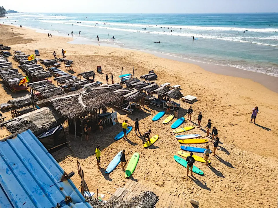 Sun beds and shaded beach huts overlooking Kabalana