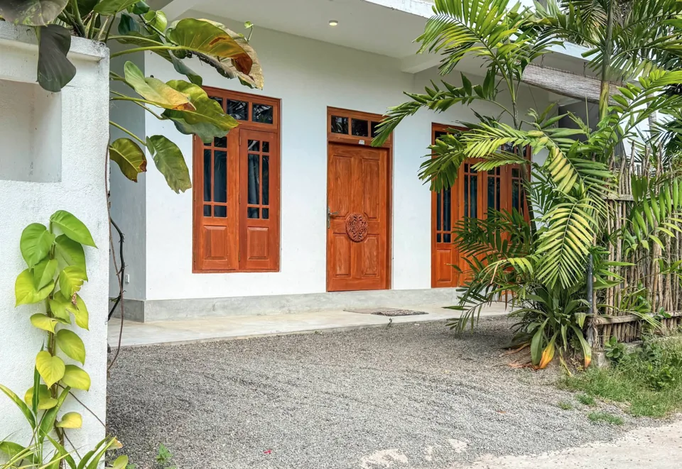 Ashen Surf House surrounded by tropical plants in Kabalana